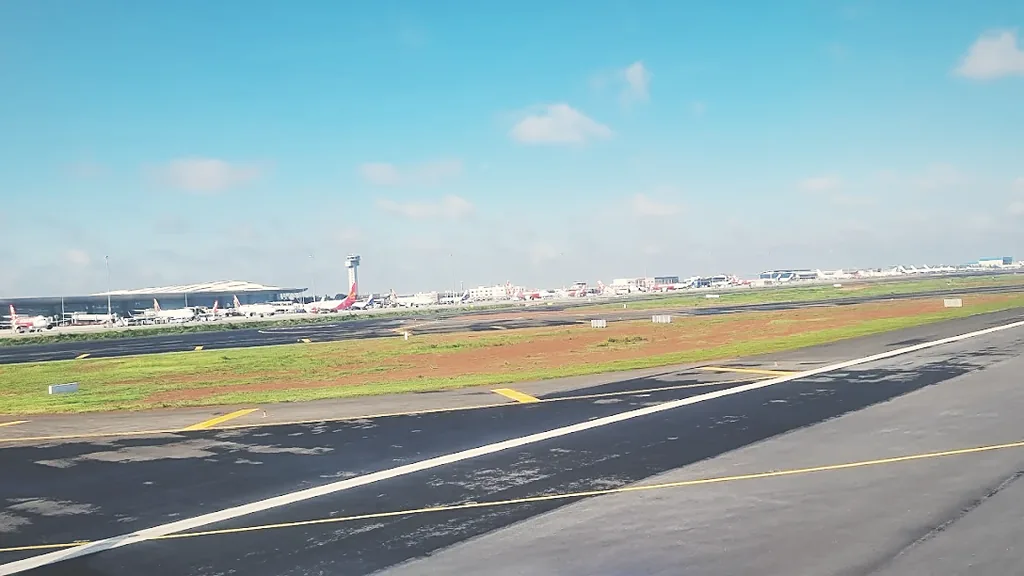 Aircraft on stand at Bangalore International Airport, seen across the airside verge