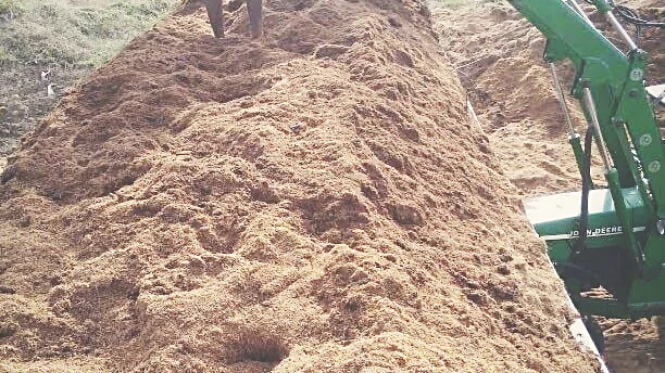 Growing medium stockpiled and turned on site